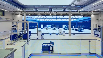 Moderne Fabrik mit Robotern, Digitalanzeigen und blauer Beleuchtung, die fortschrittliche Fertigungstechnologie repräsentiert.